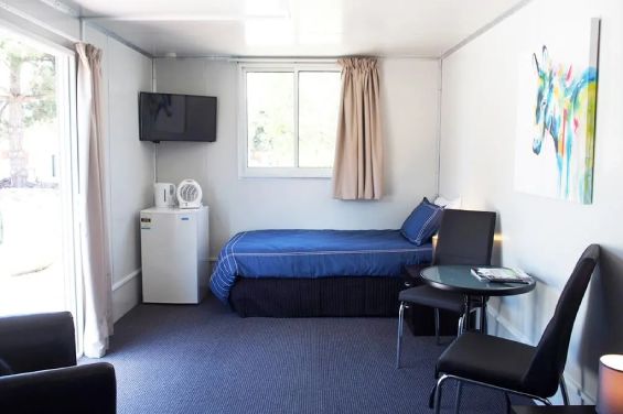 LV Cabins - bed, TV and fridge