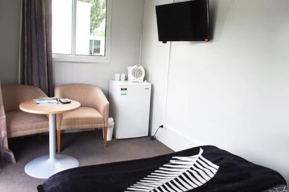 LV Cabins - table, TV and fridge