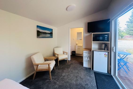 Flax Pod Premium Cabins - TV and fridge