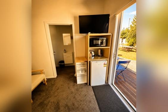 Flax Pod Premium Cabins - TV and fridge